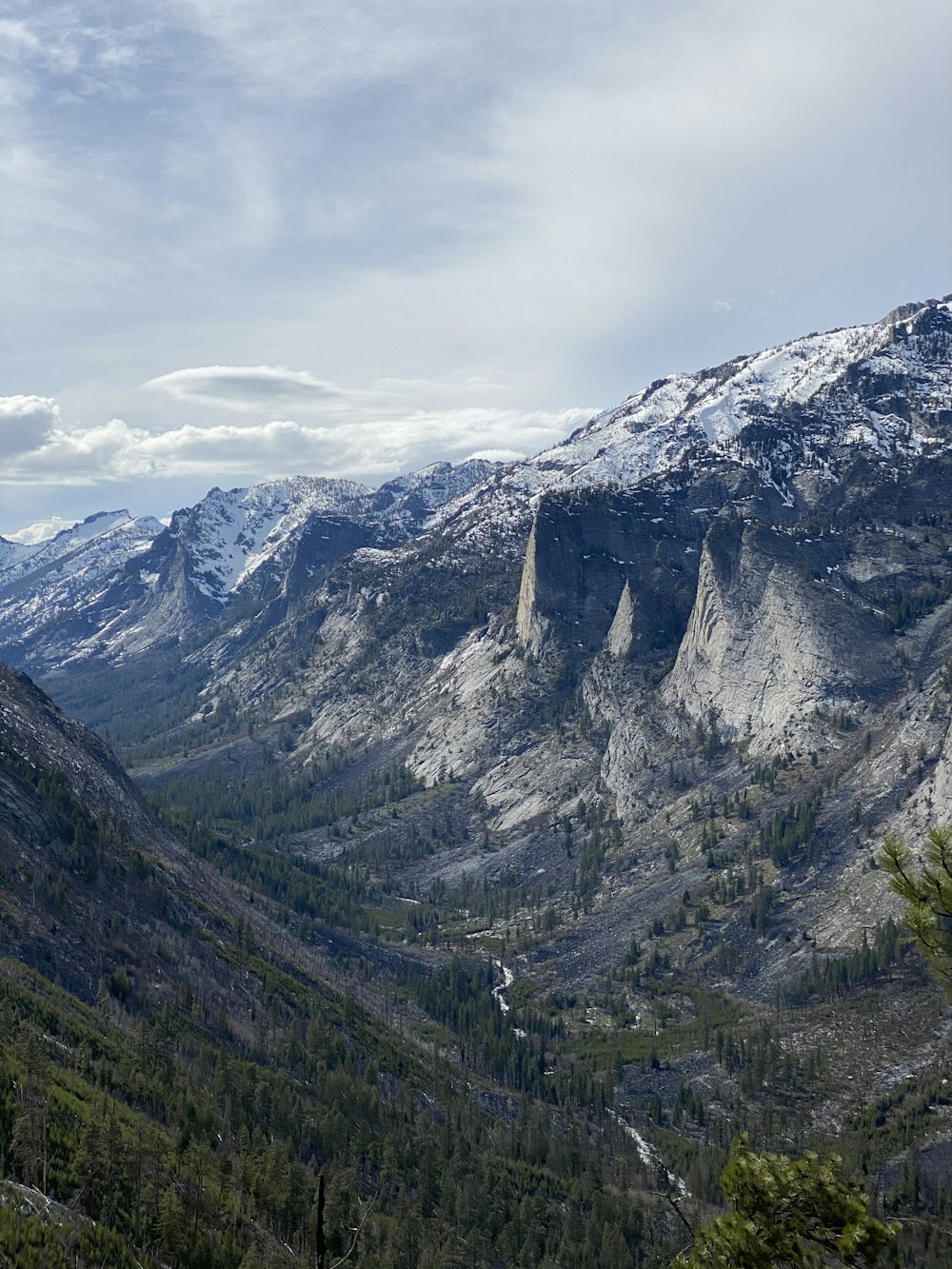 green and gray mountains under white cloudy sky during daytime