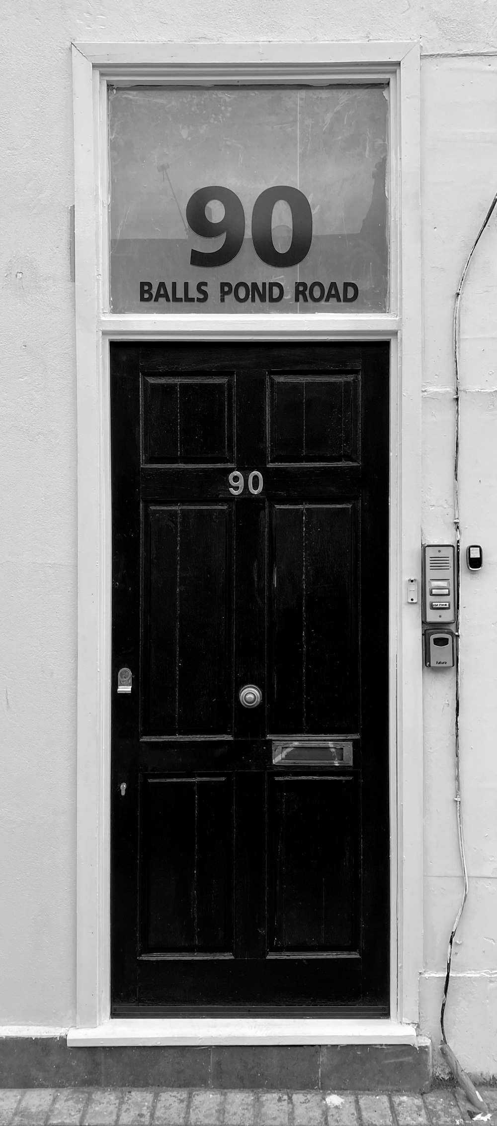 black wooden door with silver door lever