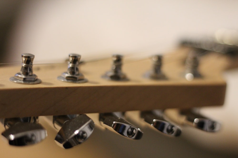 a close up of a guitar's neck and frets