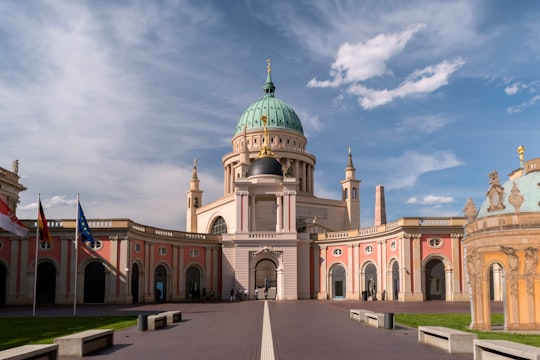 green and white dome building under blue sky during daytime in St. Nikolaikirche Potsdam Germany