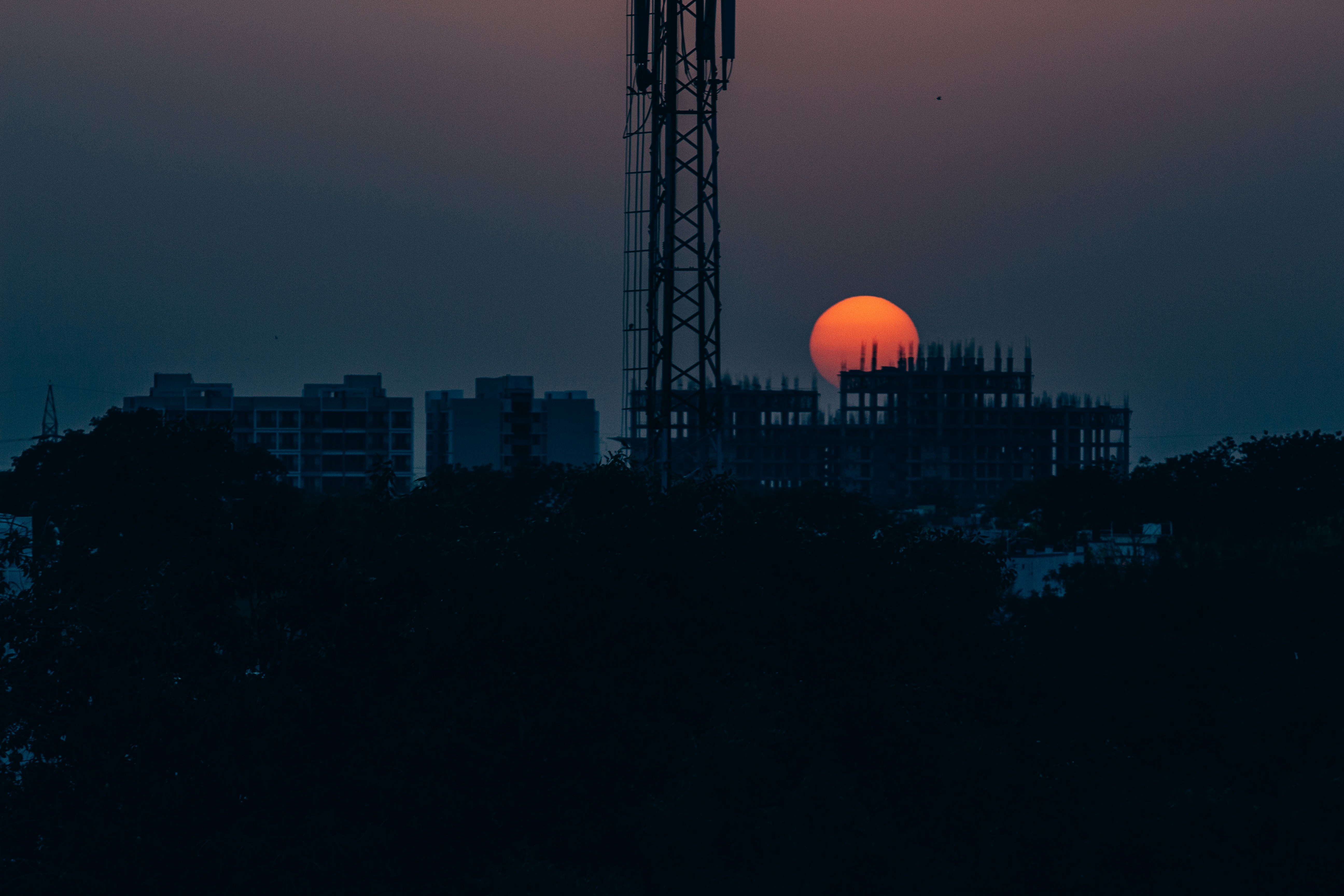 silhouette of building during sunset
