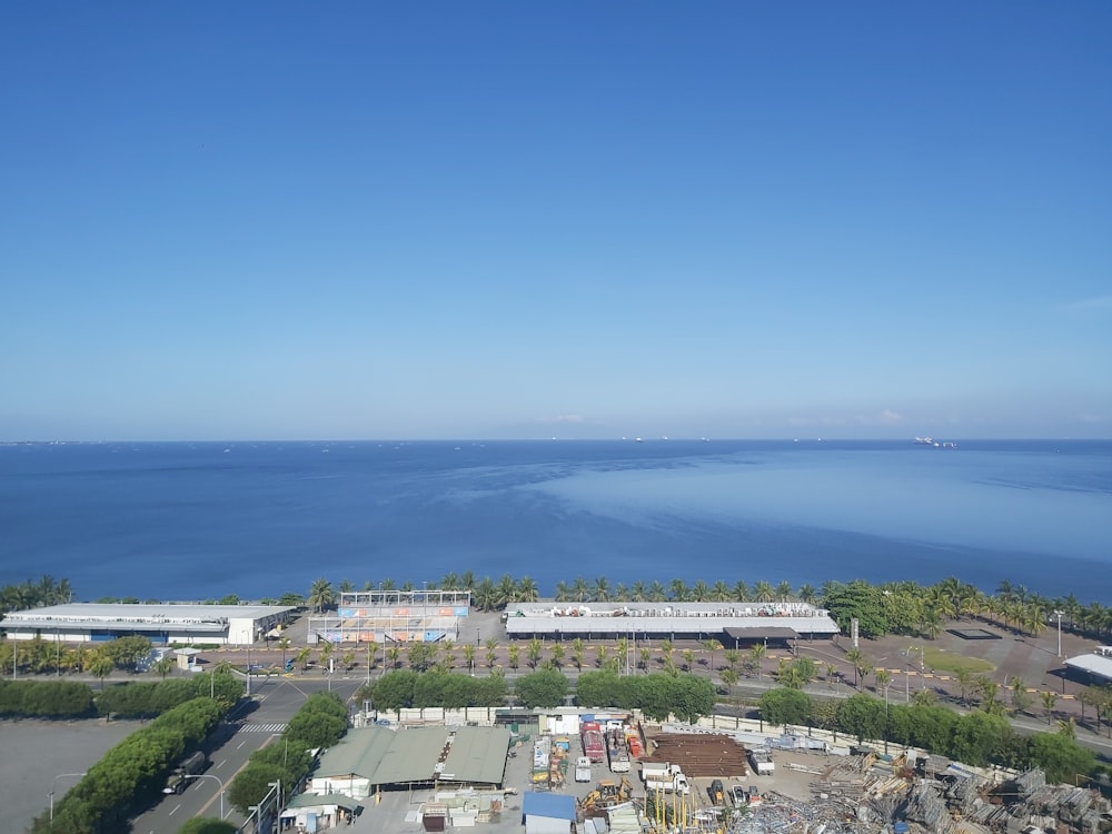 aerial view of city buildings near body of water during daytime