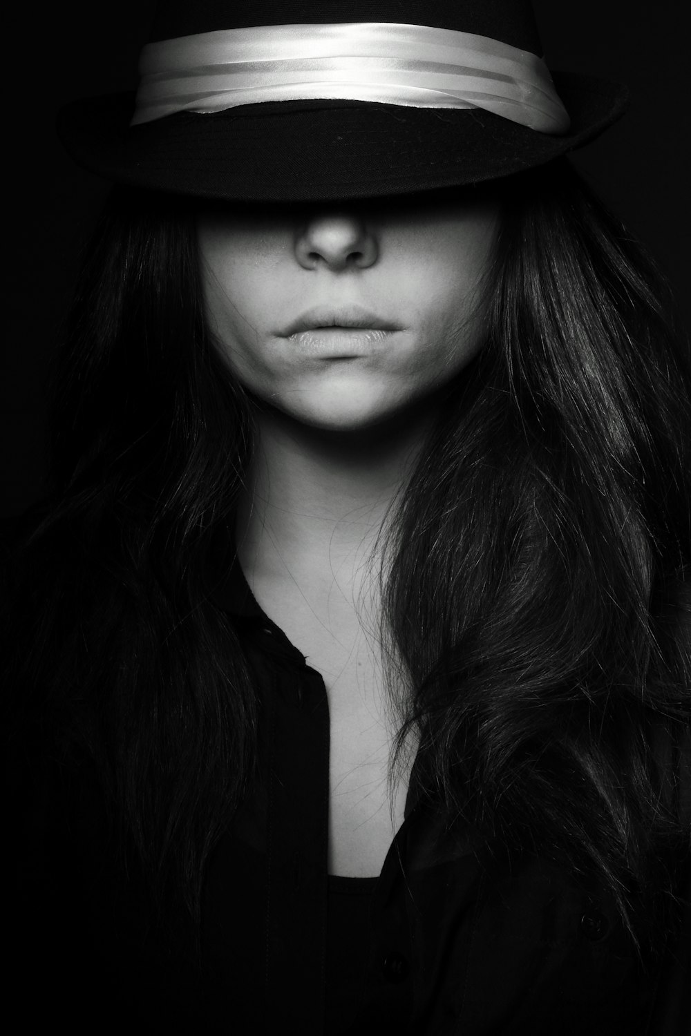grayscale photo of woman wearing black hat