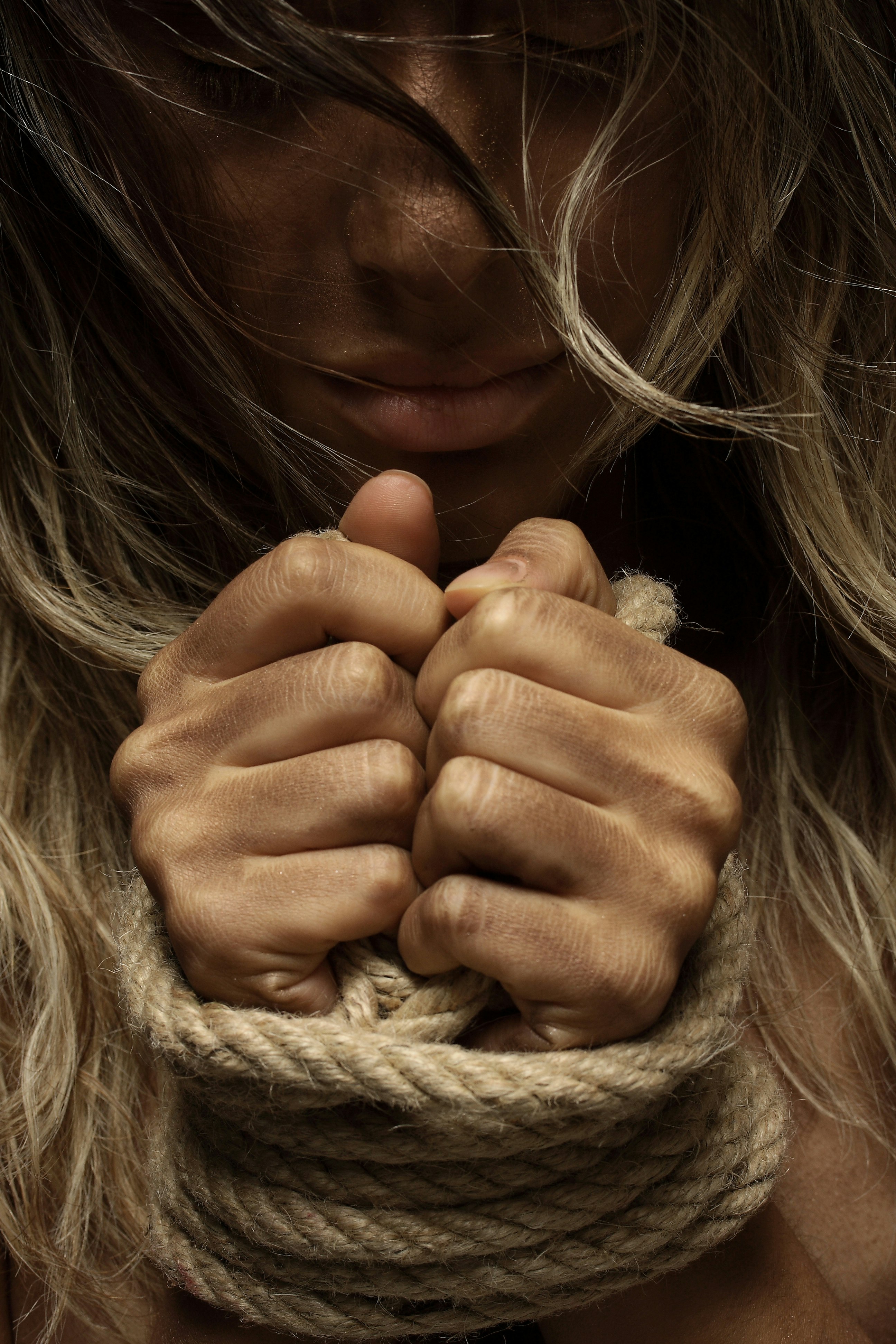 girl covering her face with her hand