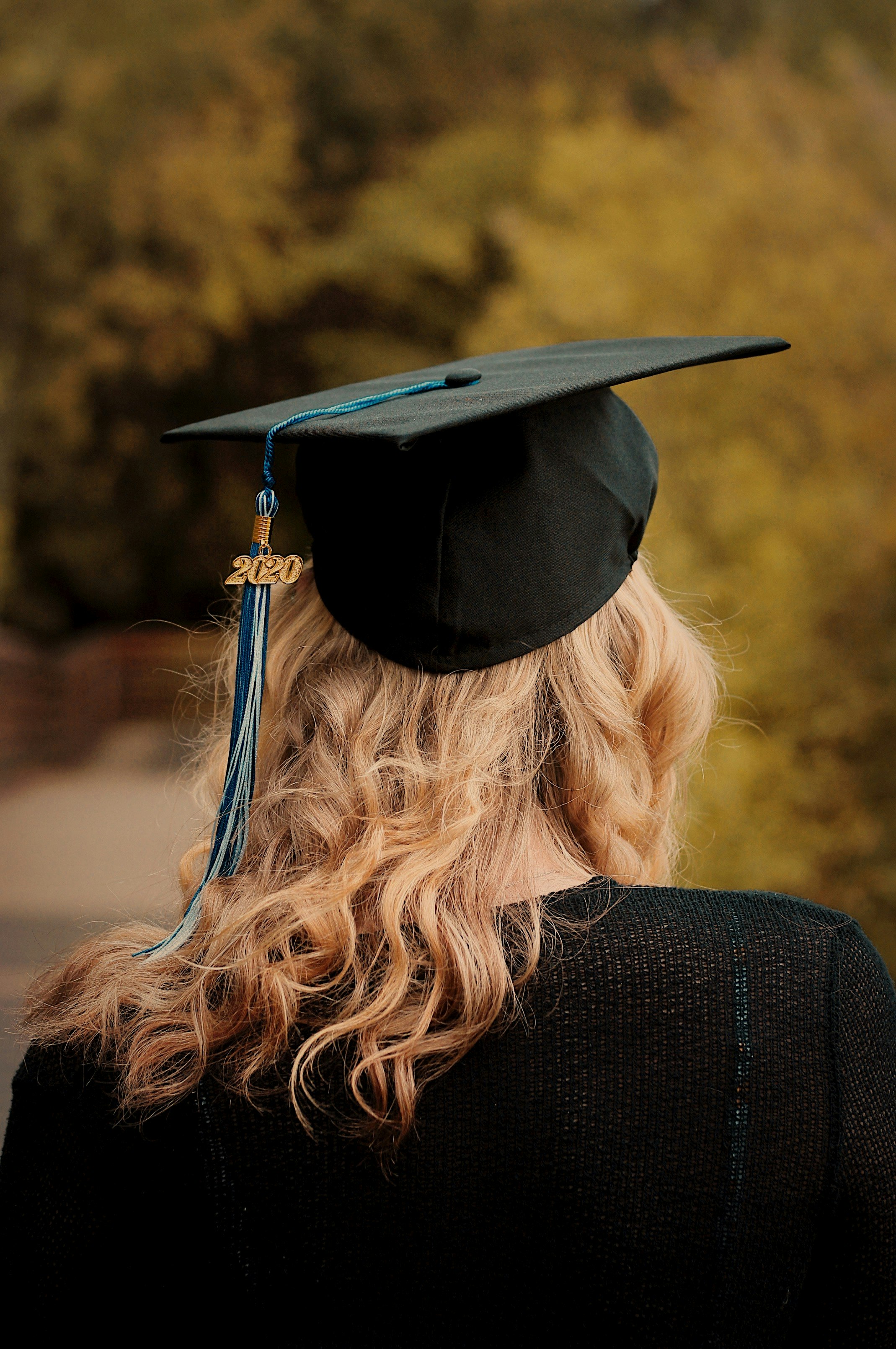 woman wearing academic hat and black academic gown