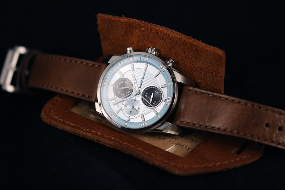brown leather strap silver round chronograph watch