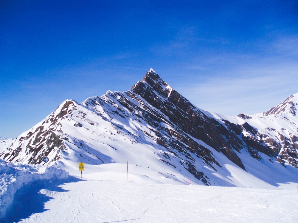 snow covered mountain under blue sky during daytime