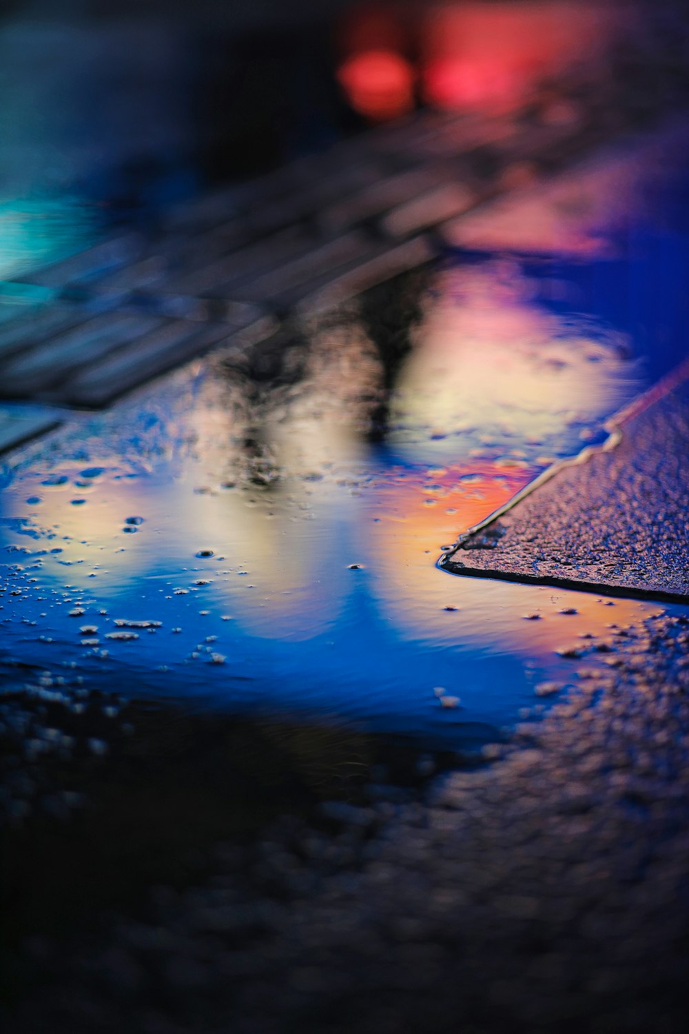 water droplets on brown concrete floor