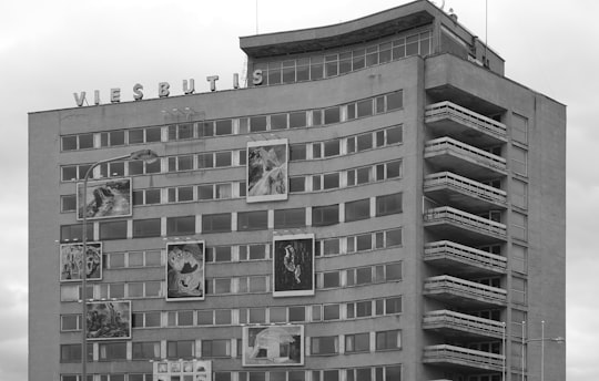grayscale photo of concrete building in Panevezys Lithuania
