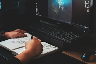 person writing on white paper