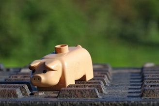 Animated pig character causing a playful mess with wooden crates and scattered screws.