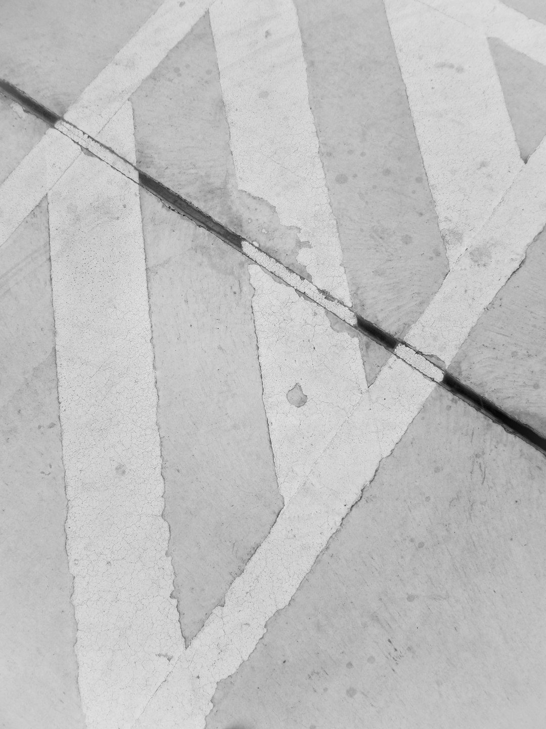 black and white walking stick on gray concrete floor