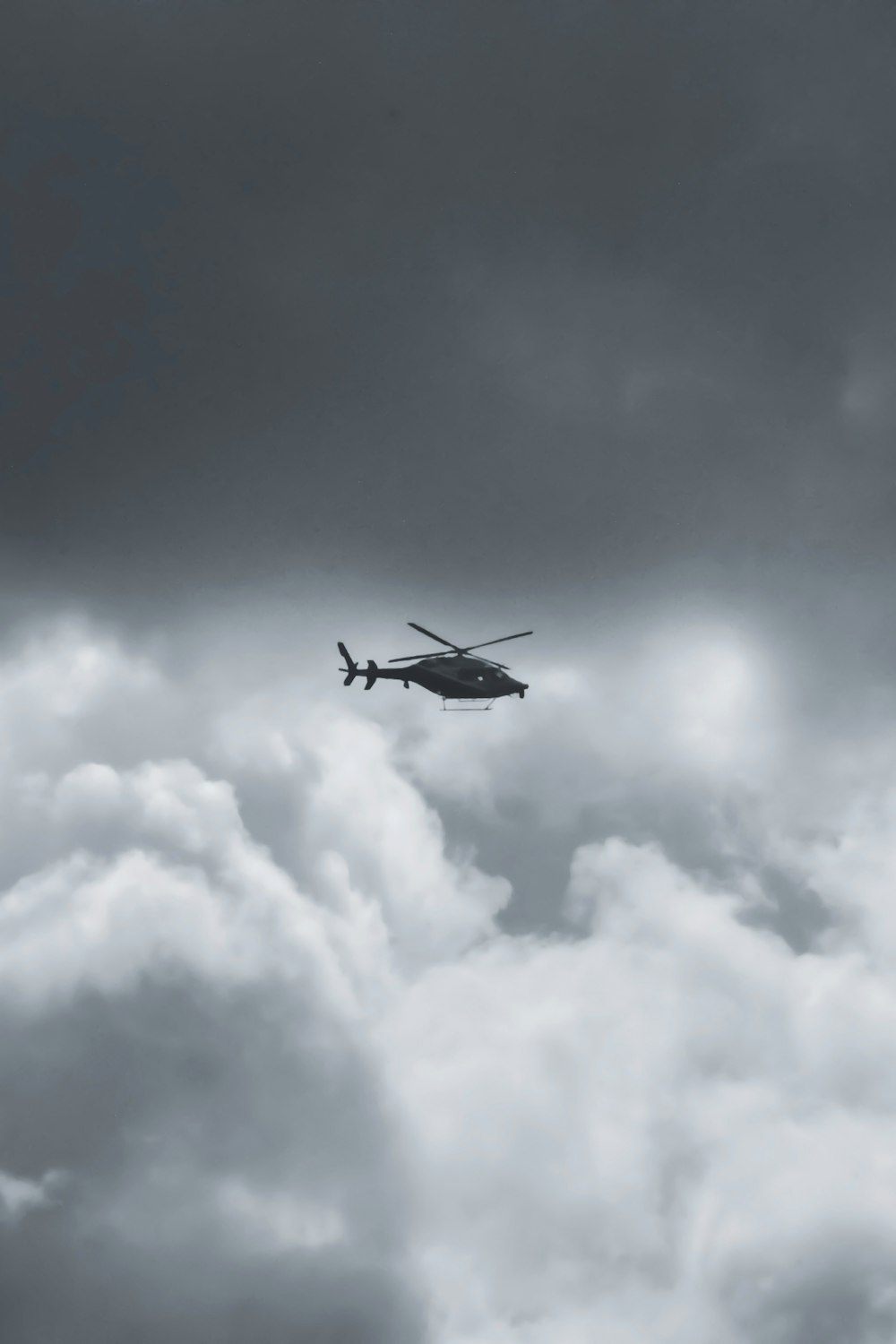 black airplane flying in the sky during daytime