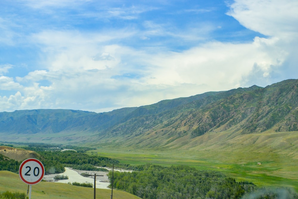 green mountains under white clouds during daytime