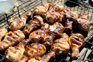grilled chicken legs on metal grill