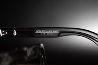 Close-up of the teyes logo engraved subtly on the temple of a premium eyeglass frame.