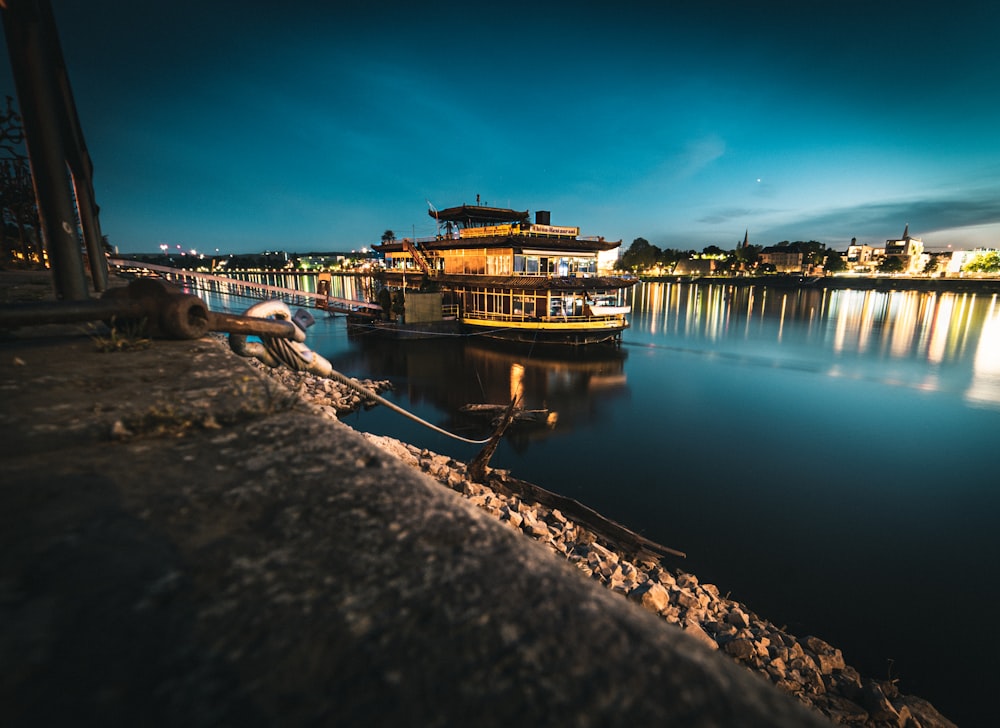 brown wooden dock on body of water during night time