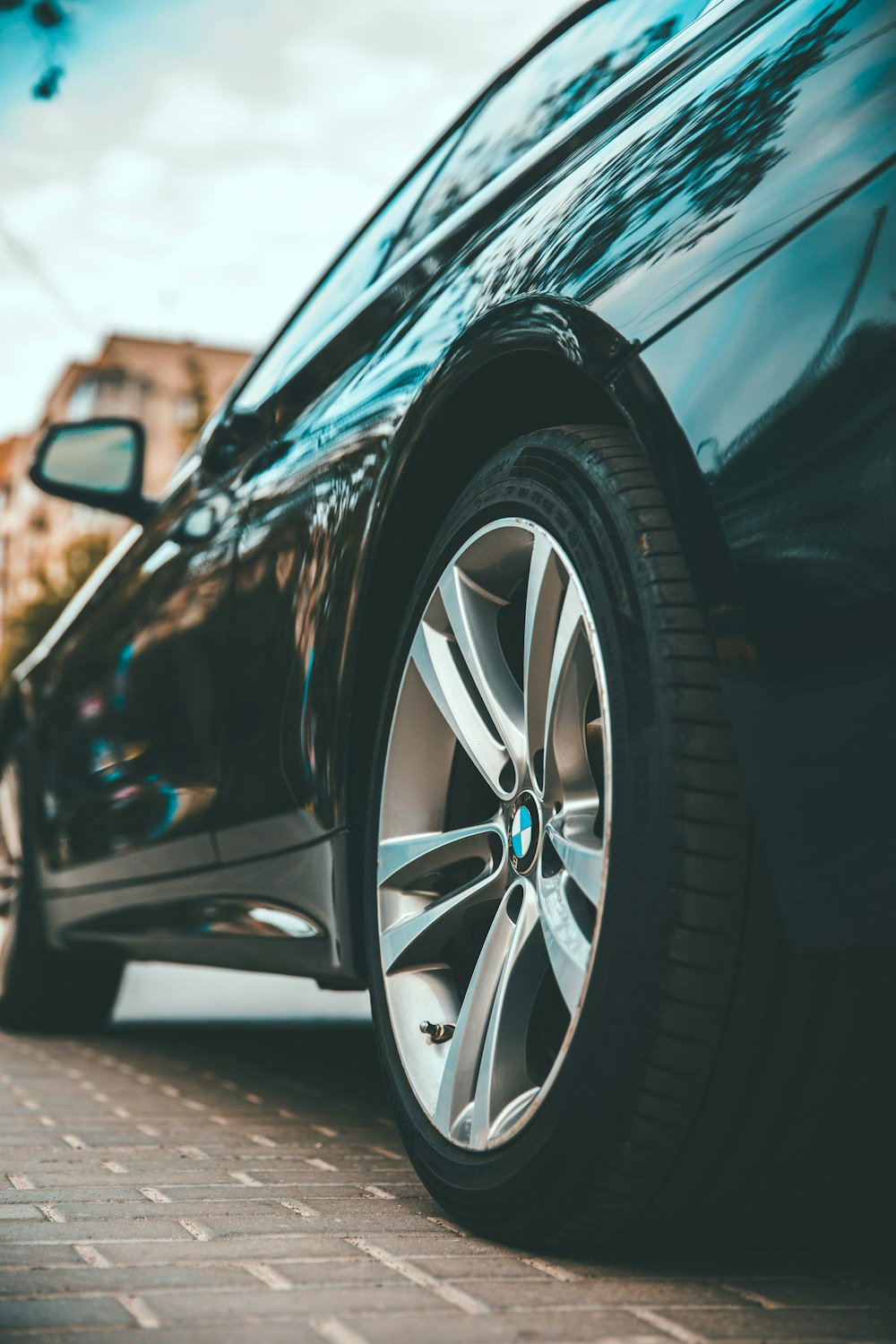 black car on gray asphalt road during daytime