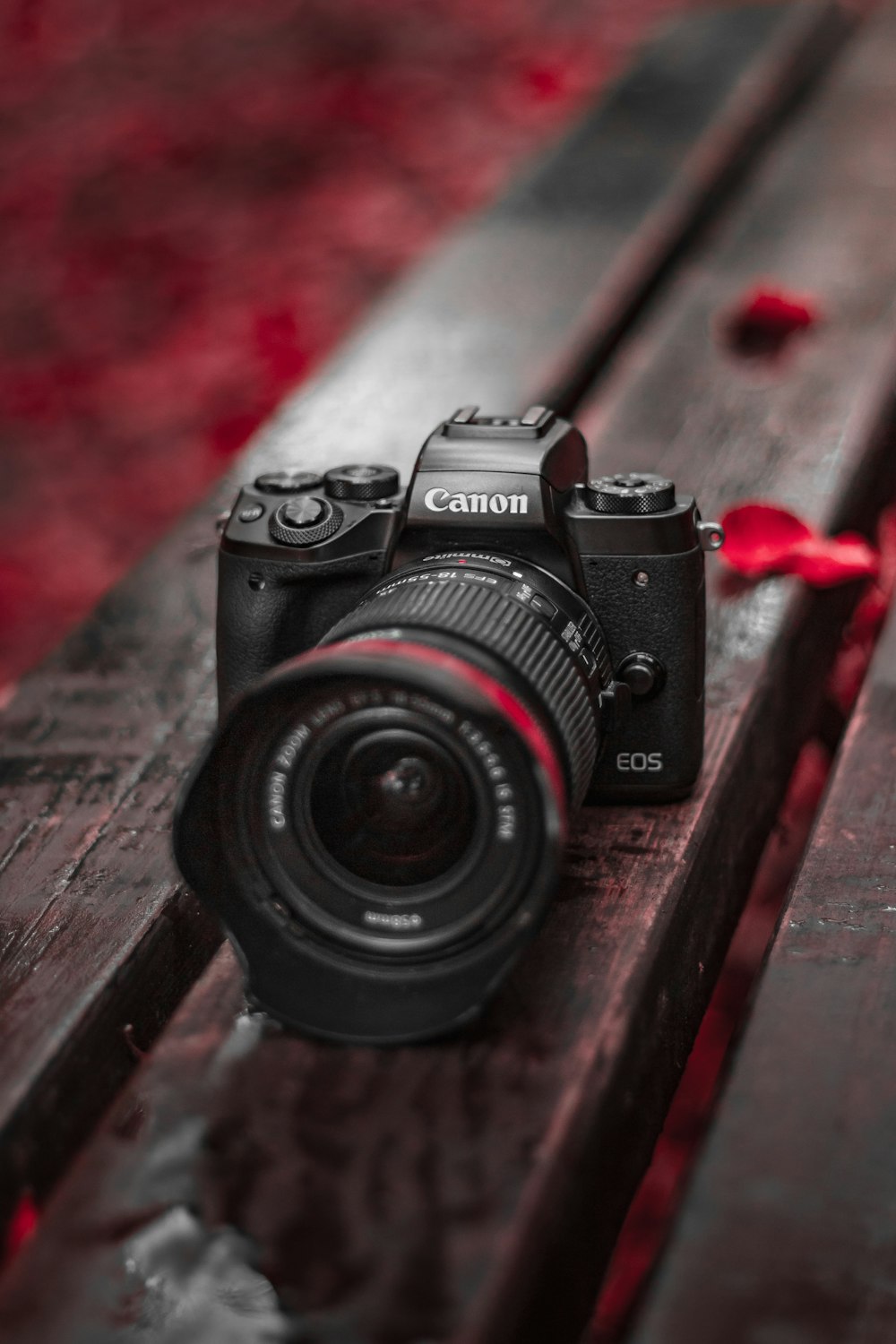 black nikon dslr camera on brown wooden table