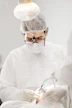 Close-up of veterinary oncologist using specialized equipment for precise diagnosis.