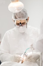 man in white dress shirt wearing black framed eyeglasses