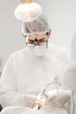Close-up of a medical professional preparing stem cell therapy treatment in a modern clinic.