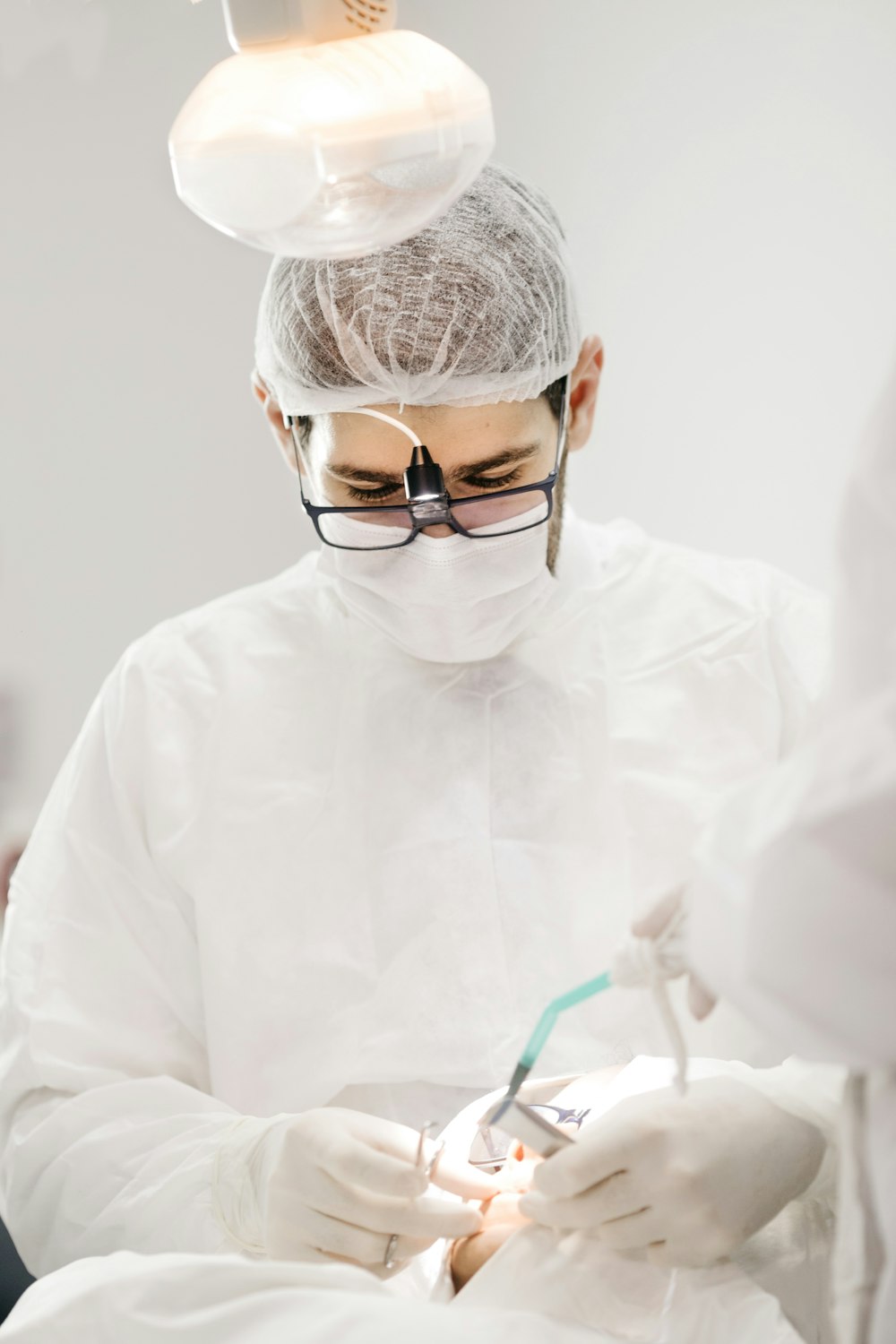 man in white dress shirt wearing black framed eyeglasses