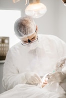 man in white dress shirt wearing black framed eyeglasses
