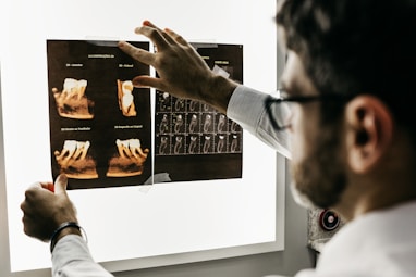 Dentist looking at x-rays of teeth.