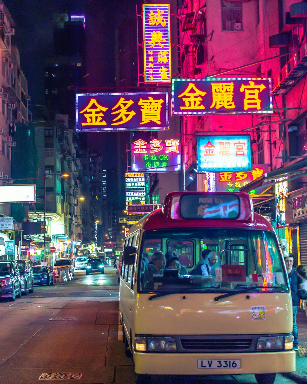 red and white van on road during night time