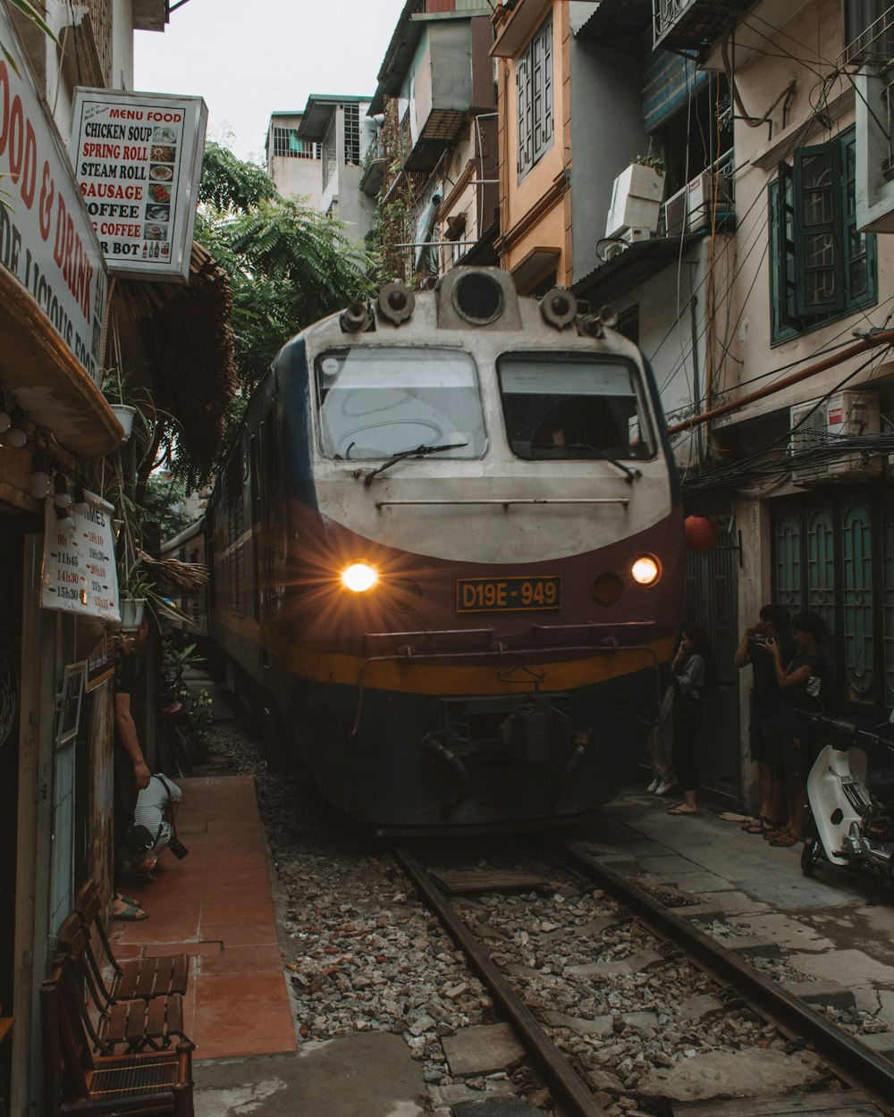 yellow and black train on the street