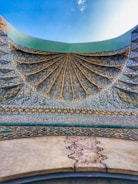 Abstract blue and gold digital arch symbolizing stability and resilience.