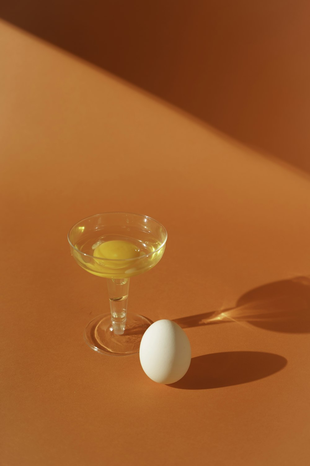 clear wine glass on red table