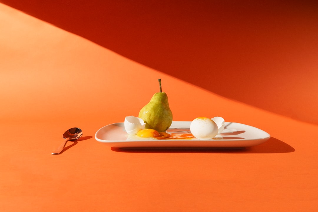 green fruit on white ceramic plate