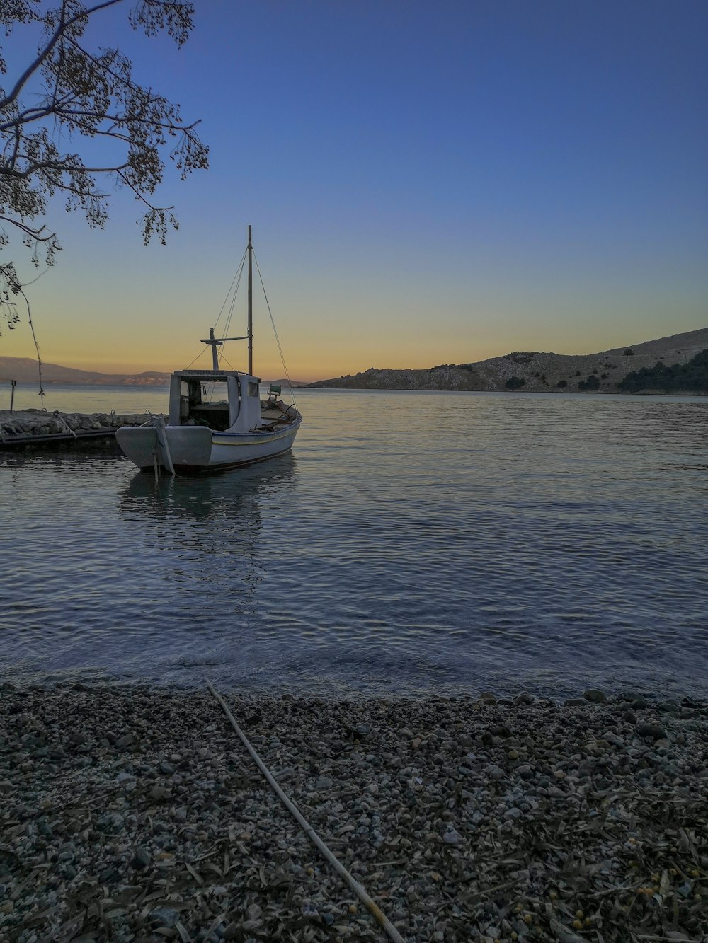 white boat on sea during daytime