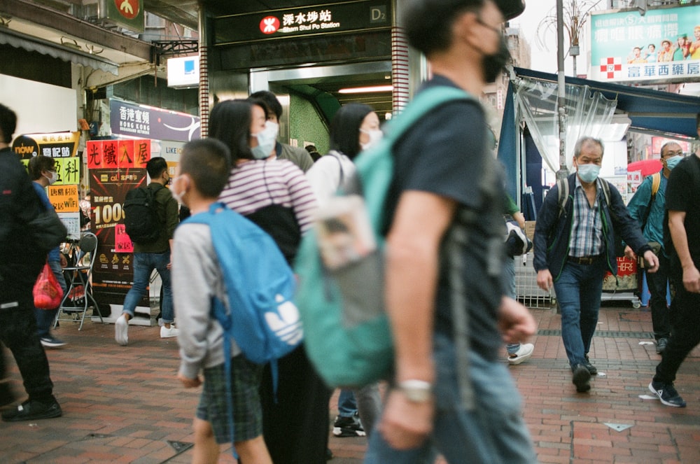 people walking on sidewalk during daytime