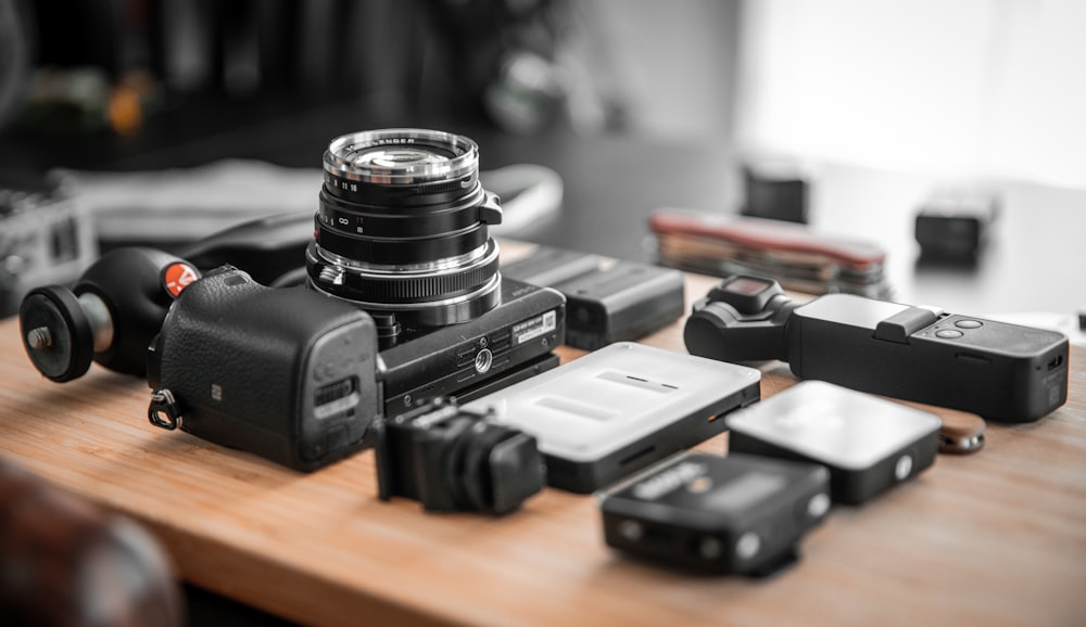 black camera on brown wooden table