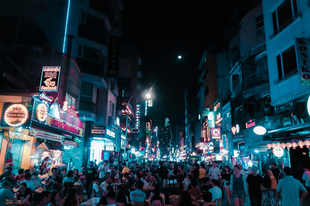 people walking on street during nighttime