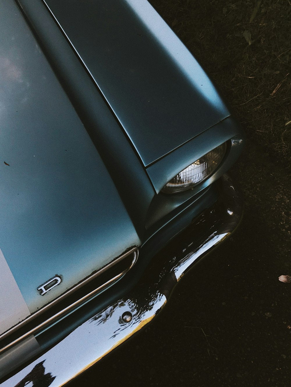 silver car on gray concrete floor