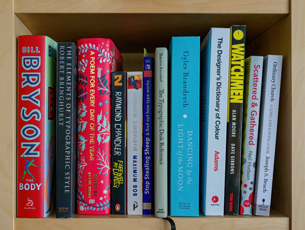 books on brown wooden shelf