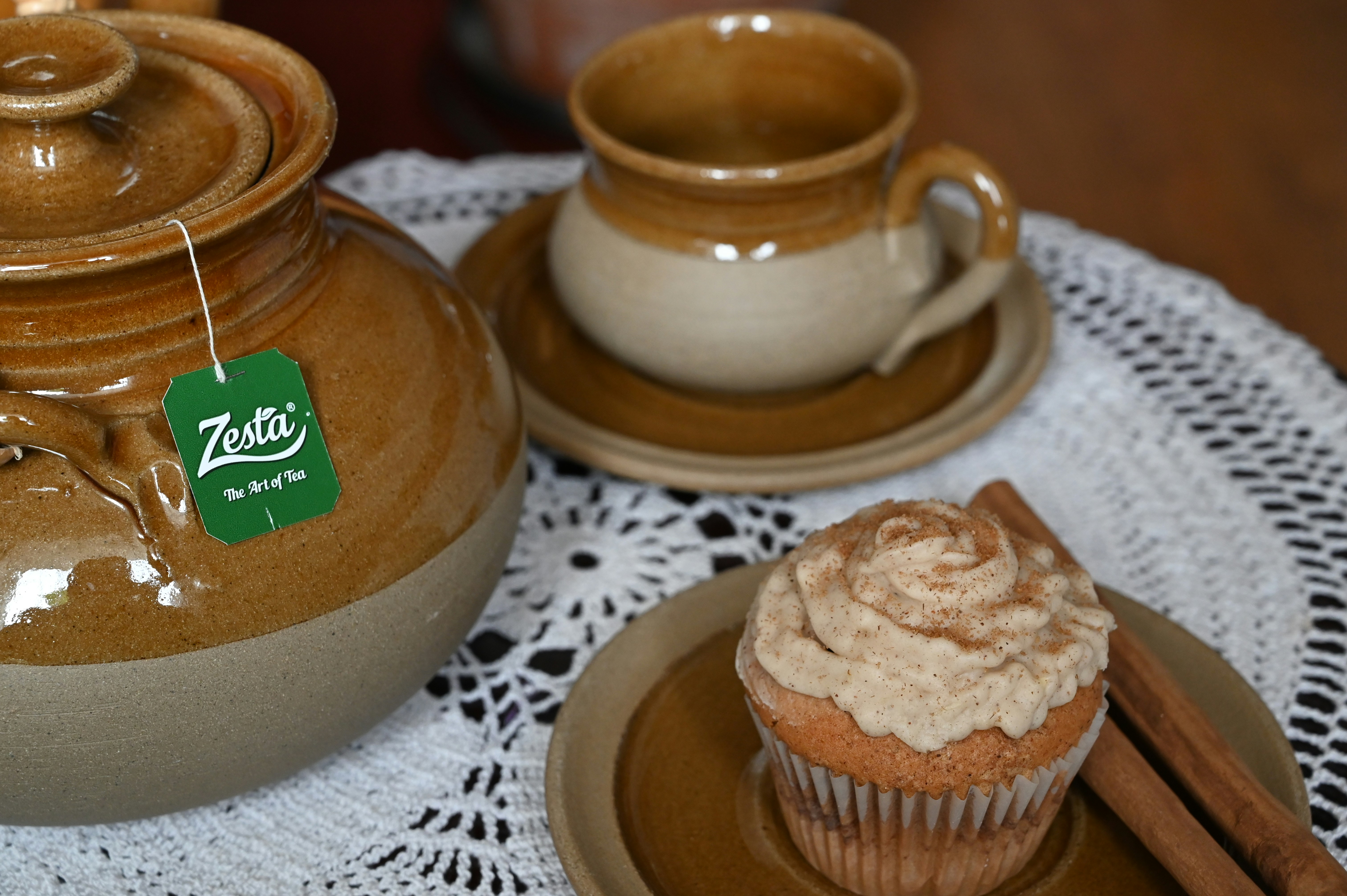 brown ceramic cup on brown saucer