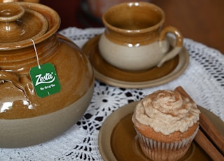 brown ceramic cup on brown saucer