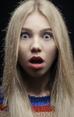 woman with blonde hair and red lipstick