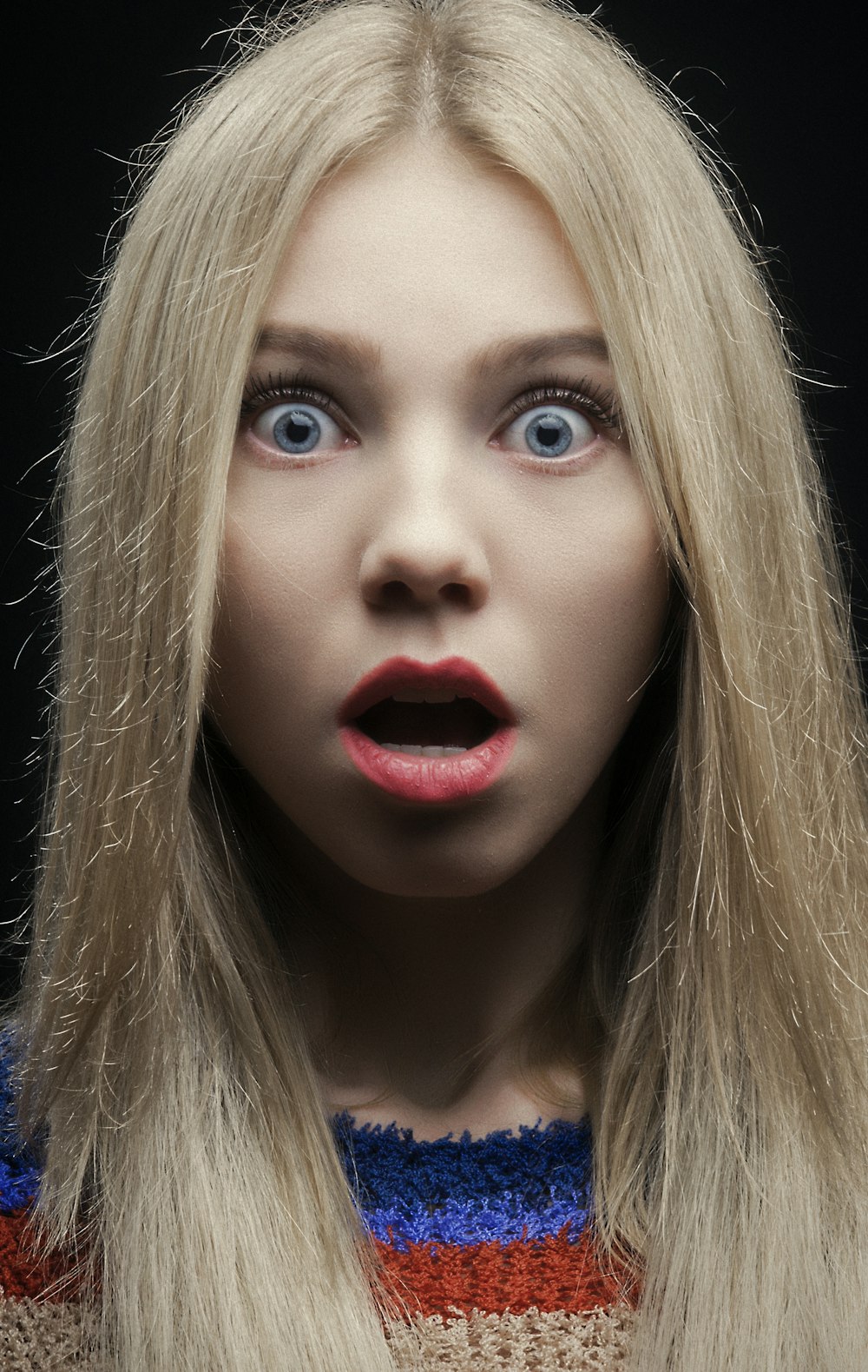 woman with blonde hair and red lipstick