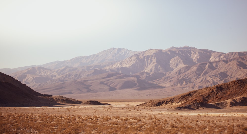 brown and gray mountains under white sky during daytime