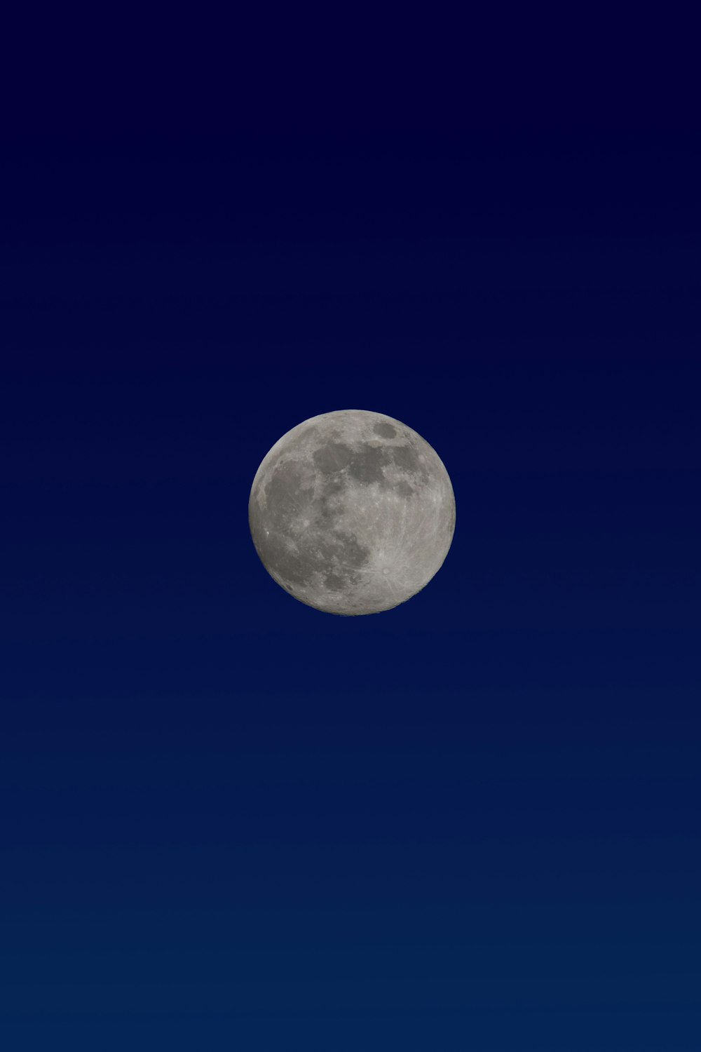 full moon in blue sky