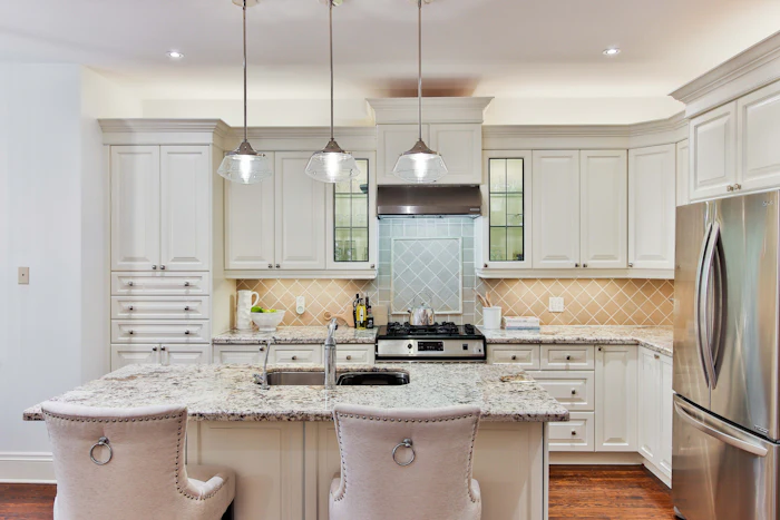 A traditional kitchen with a granite island