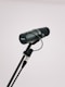 black microphone with stand on white background
