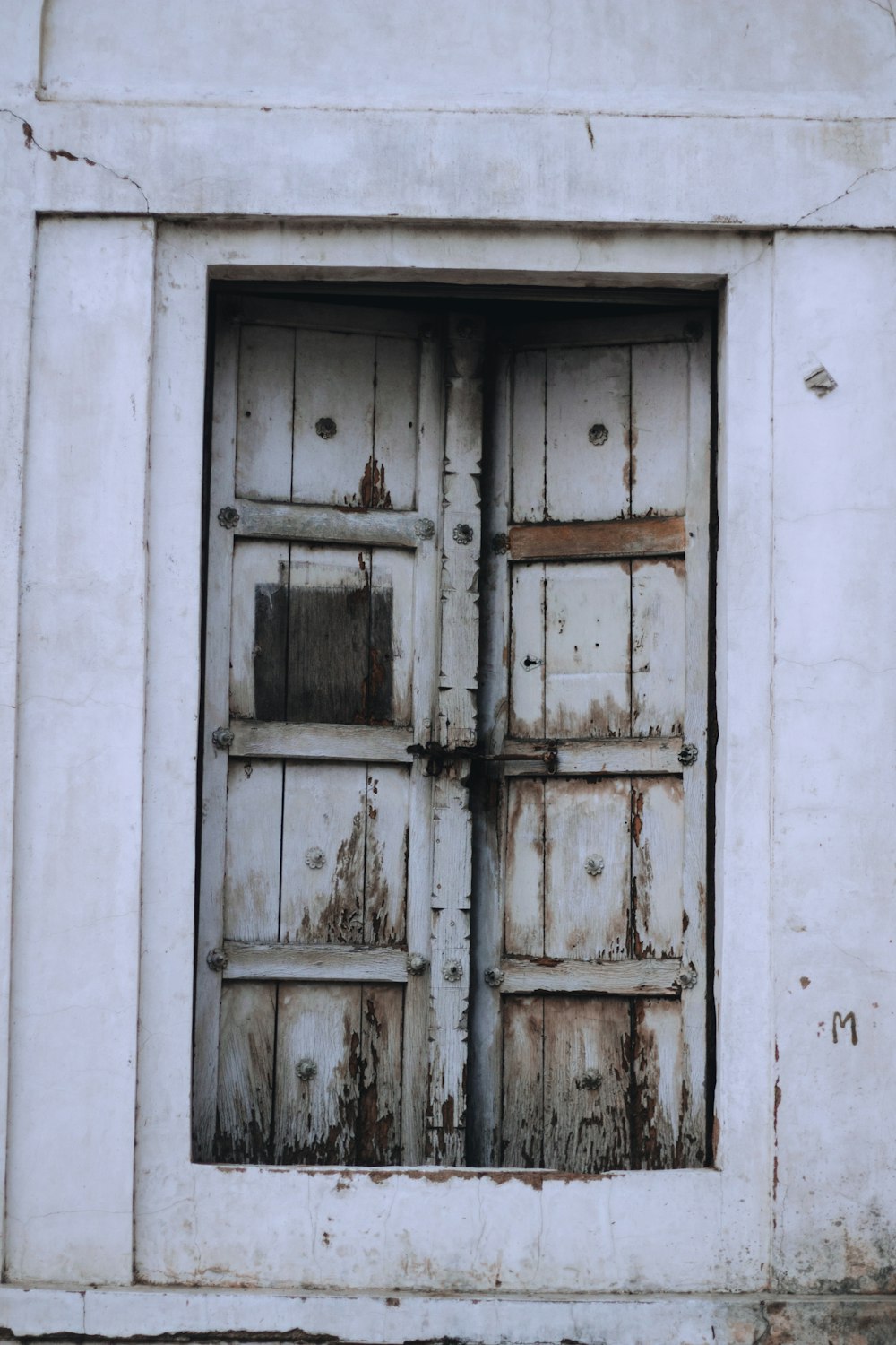 white wooden door with white wall