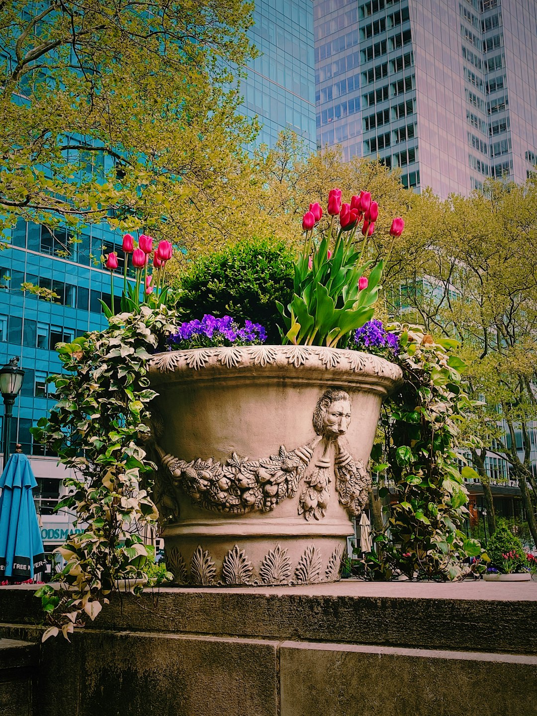 pink flowers in gray concrete pot